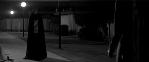 A girl walks home alone at night 